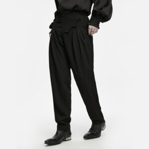Main Photo of a model wearing the Punk Rave Ink Ruins Batwing Pleated Trousers as the main product photo, showcasing the unique scalloped batwing waist flap, structural 3D hip pleating, and sleek tapered leg silhouette